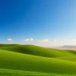 Klima landscape showcasing the contrast between lush greenery and a sunburnt desert under soft morning light.